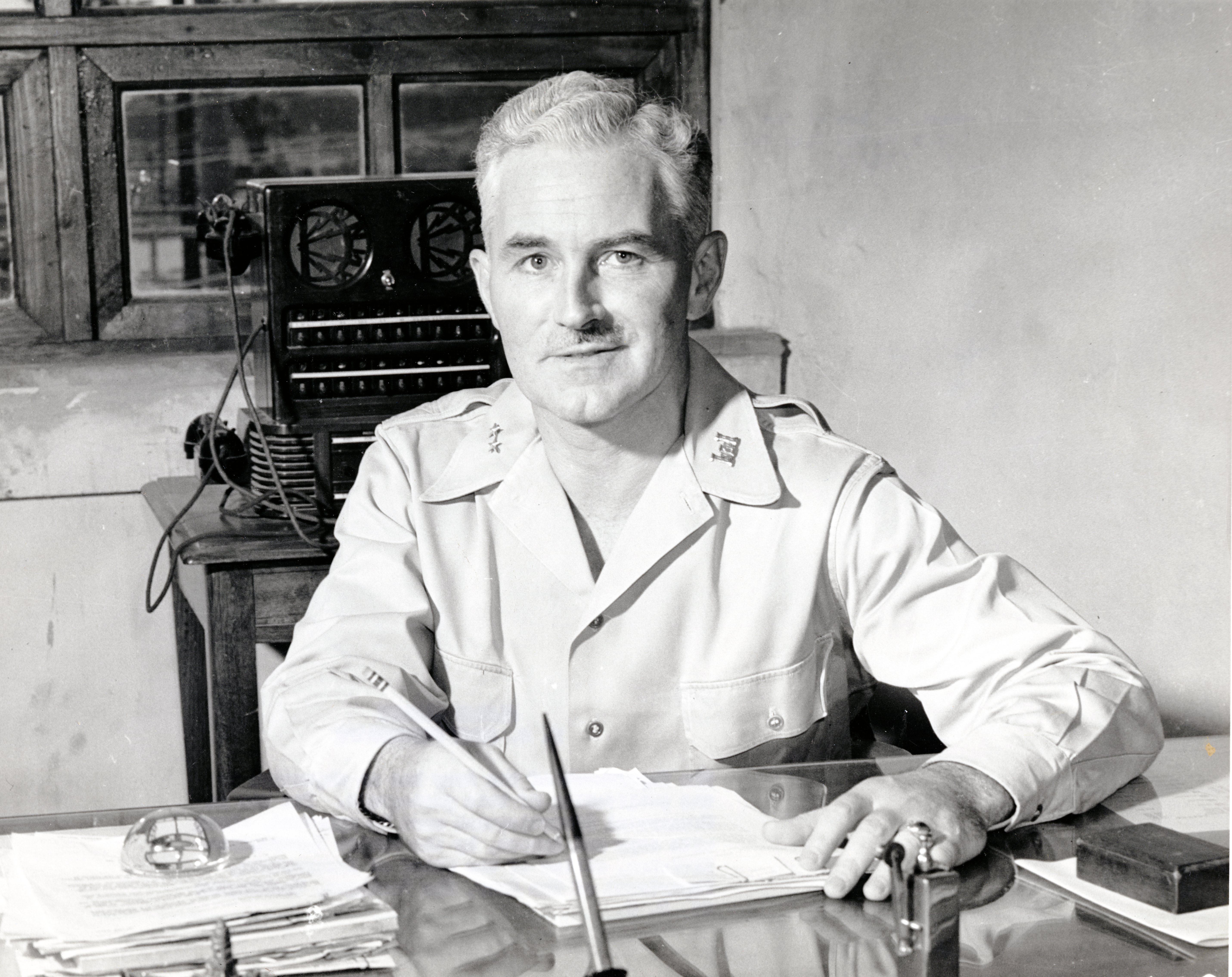 Casey sitting at a desk Casey sitting at a desk